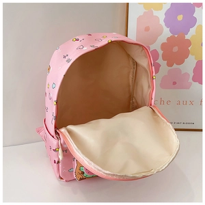 Close-up of pink school bag featuring cartoon bear prints and durable dual zippers