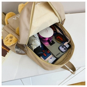 Beige canvas backpack with cute plush bear ears and large interior storage space