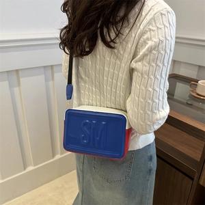 Crossbody bag with red white blue stripes, wide strap and SM embossed logo