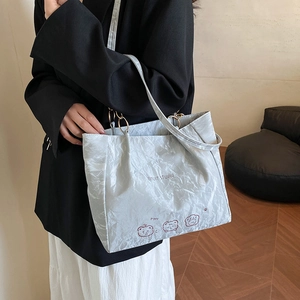 Minimalist light gray tote bag with bear graphic and EMUIT STUDIO print for women