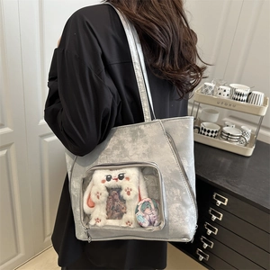 Silver grey metallic tote bag with clear display window and plush rabbit accessory
