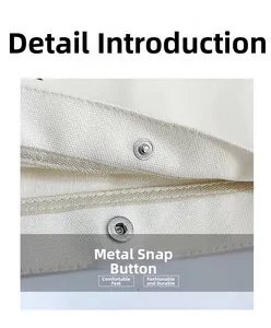 Macro shot of durable silver metal snap button closure on a beige canvas tote bag