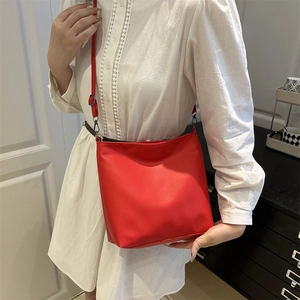 Minimalist red faux leather tote bag for women with adjustable strap for office commute