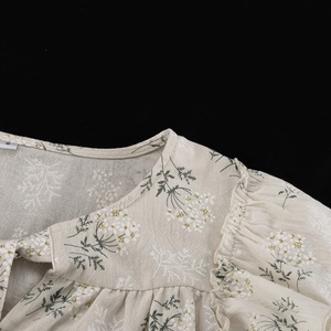 Macro shot of French ruffle collar and floral print fabric on the S-size blouse