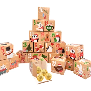 Christmas advent calendar boxes with numbers 1-24 and chocolate inside open gift box