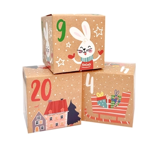 Detail of kraft paper advent calendar boxes with festive numbers and Christmas illustrations