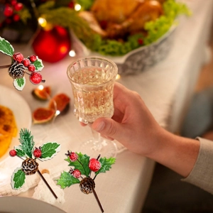 Detail of frosted Christmas berry branch with pine cones and faux snow for DIY decor