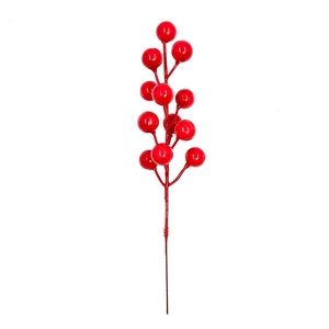 Close-up of artificial red berry branches with glossy finish for Christmas table decor