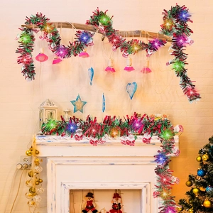 LED Christmas tinsel garland with Santa ornaments for festive fireplace and tree decor