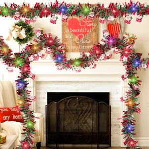 Close-up of LED Christmas tinsel garland with colorful lights and Santa charms