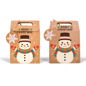 Detail of Christmas snowman kraft paper gift bag with Merry Christmas text and snowflake tag