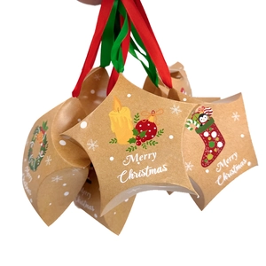 Detail of star-shaped Christmas chocolate boxes with festive prints and ribbons