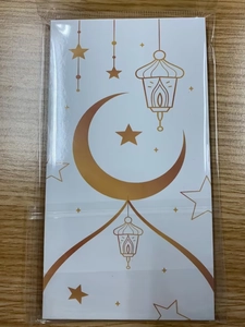Detail of Moon and Star Eid envelopes with Ramadan lanterns in transparent packaging