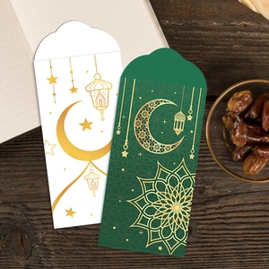 Detail of moon and castle gold foil patterns on Eid Mubarak red envelopes set
