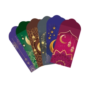 Detail view of colorful Eid al-Fitr money envelopes with gold moon and lantern patterns