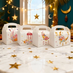 Detailed view of four festive gift boxes with colorful moon prints on white cardstock