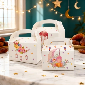 White Eid paper gift box with cartoon moon and floral prints for festive desserts