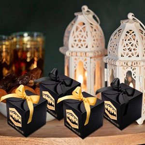 Black square Umrah Mubarak gift boxes with gold Kaaba pattern and satin ribbon bows