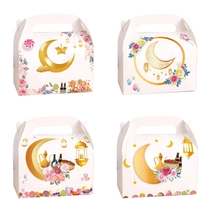Detail of Eid party gift boxes with gold crescent moon and star patterns and handles