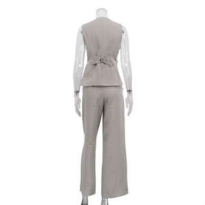 Rear view of three-piece suit vest with metal buckle strap and wide-leg trousers