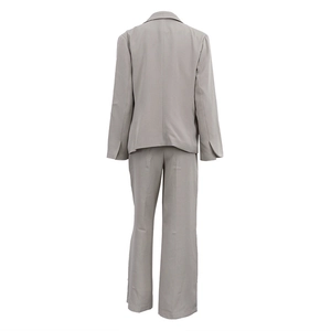 Detailed back view of a light gray three-piece suit with blazer and wide-leg trousers