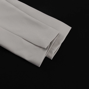 Detailed close-up of light gray blazer sleeve cuffs showing high-quality stitching