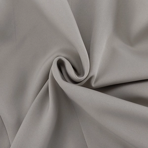 Detailed macro view of grey woven fabric texture with smooth drape and high-quality finish
