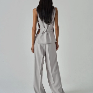 Light gray women's three-piece suit featuring a sleeveless vest with back lace-up detail