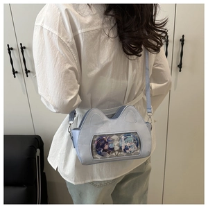Detail of light blue cat-ear ita bag with transparent window for anime badges