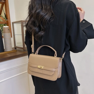 Chic khaki faux leather crossbody bag for women featuring a gold turn-lock and adjustable strap