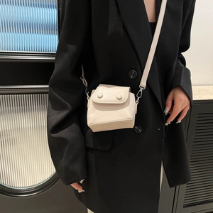 Chic cream-colored mini crossbody bag for women with dual round decorative buckles