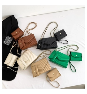 V-quilted chain shoulder bag set in five colors including black, brown, and cream