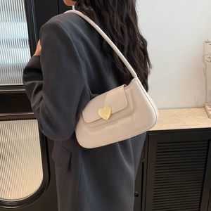 Minimalist creamy white shoulder bag with gold heart clasp and sleek PU leather texture