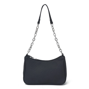 Chic black crescent underarm bag with silver chain strap and woven texture detail