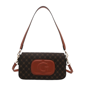 Chic underarm shoulder bag with vintage monogram pattern and embossed G logo