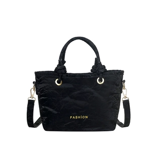Chic black pleated bucket bag with gold 'FASHION' lettering and metal ring handles