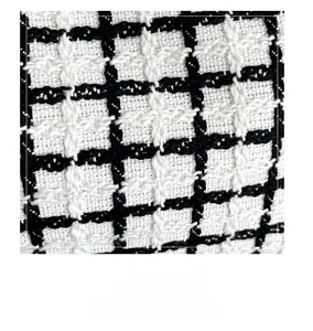Macro shot of high-quality black and white tweed fabric texture for large tote bags