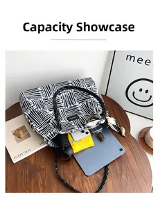 Interior view showing the large capacity of the blue striped tote bag with daily items