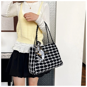 Detail view of checkered canvas tote bag with silk scarf and FASHION leather label