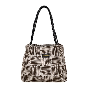 Retro geometric woven tote bag with leather handles and fashion label detail