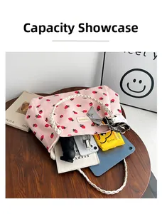 Pink corduroy strawberry tote bag showing large capacity for tablet, phone, and daily items