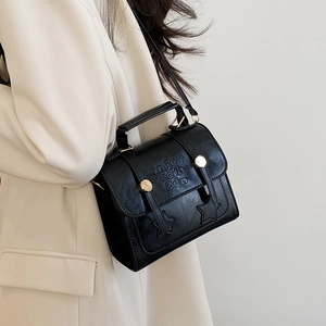 Retro black PU leather messenger bag with star details and embossed lettering for women
