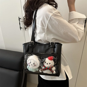 Large black leather tote bag with transparent pocket and plush dolls for daily commute