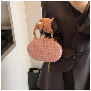 Pink tweed oval evening bag with gold chain strap and sparkling diamond clasp