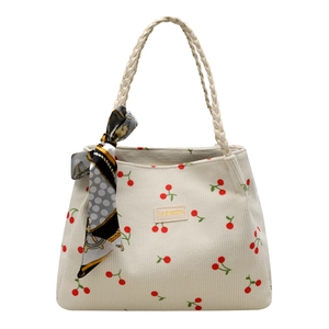 Beige corduroy tote bag with red cherry embroidery and a woven rope handle