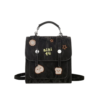 Retro-Rucksack aus schwarzem Nylon mit Cartoon-Stickerei und strukturierter Optik