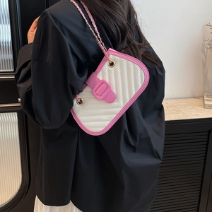 Fashionable quilted underarm bag with contrast pink trim and gold chain strap