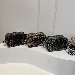 Three leopard print crossbody camera bags with SM embossed logo and wide strap