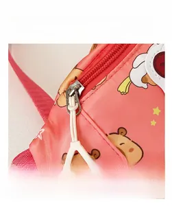 Detailed close-up of smooth zipper with white plastic puller on kids cartoon chest bag