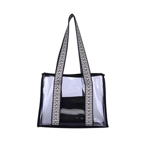 Minimalist transparent PVC tote bag with stylish black and white wave patterned handles